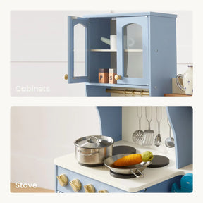 Close-up of play kitchen cabinets and stove with toy utensils and food.