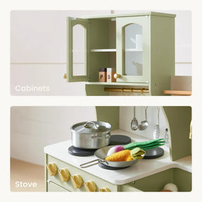 Close-up of play kitchen cabinets and stove with toy utensils and food.