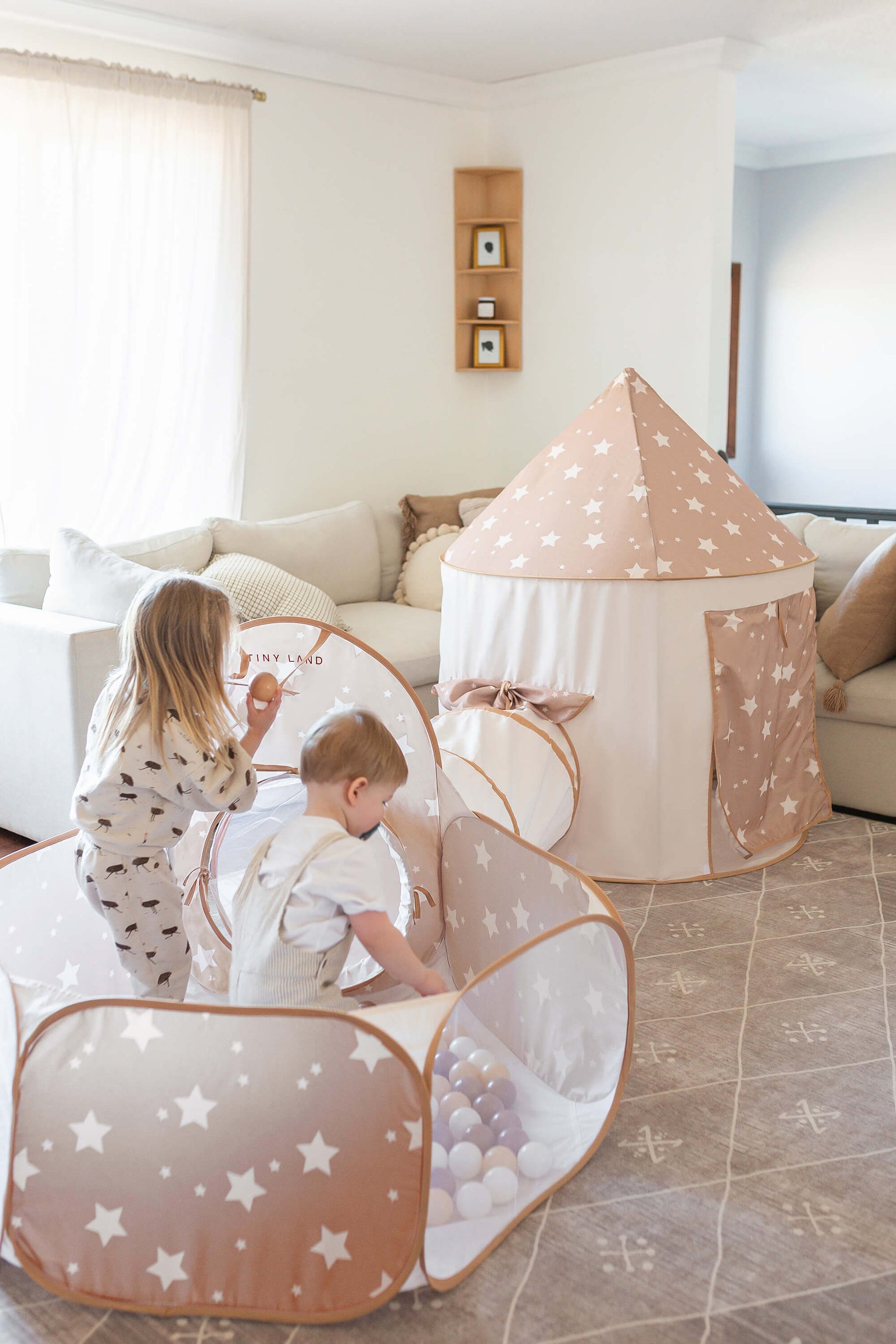 Children playing in the Tiny Land® play tunnel